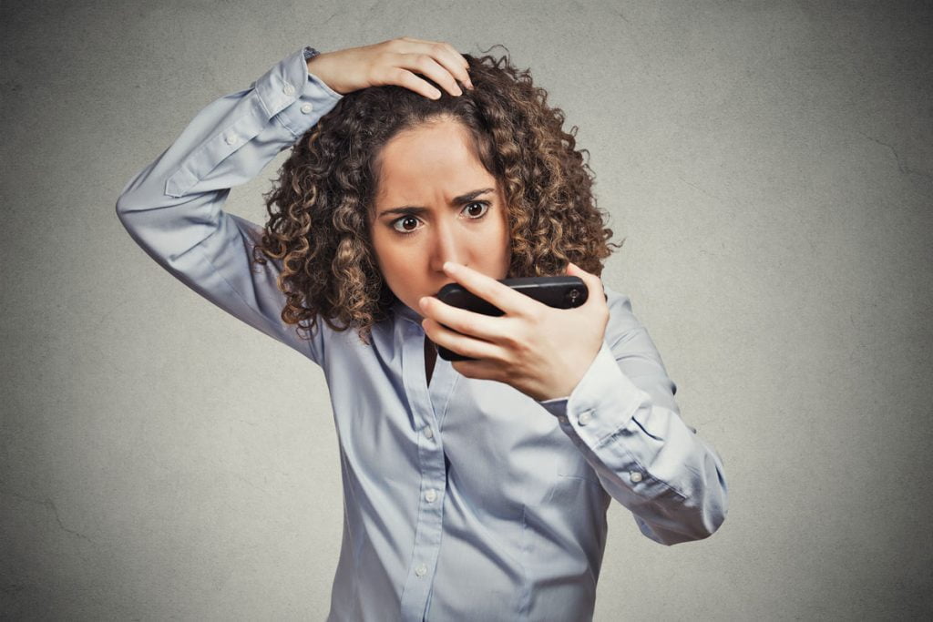 woman checking image in phone