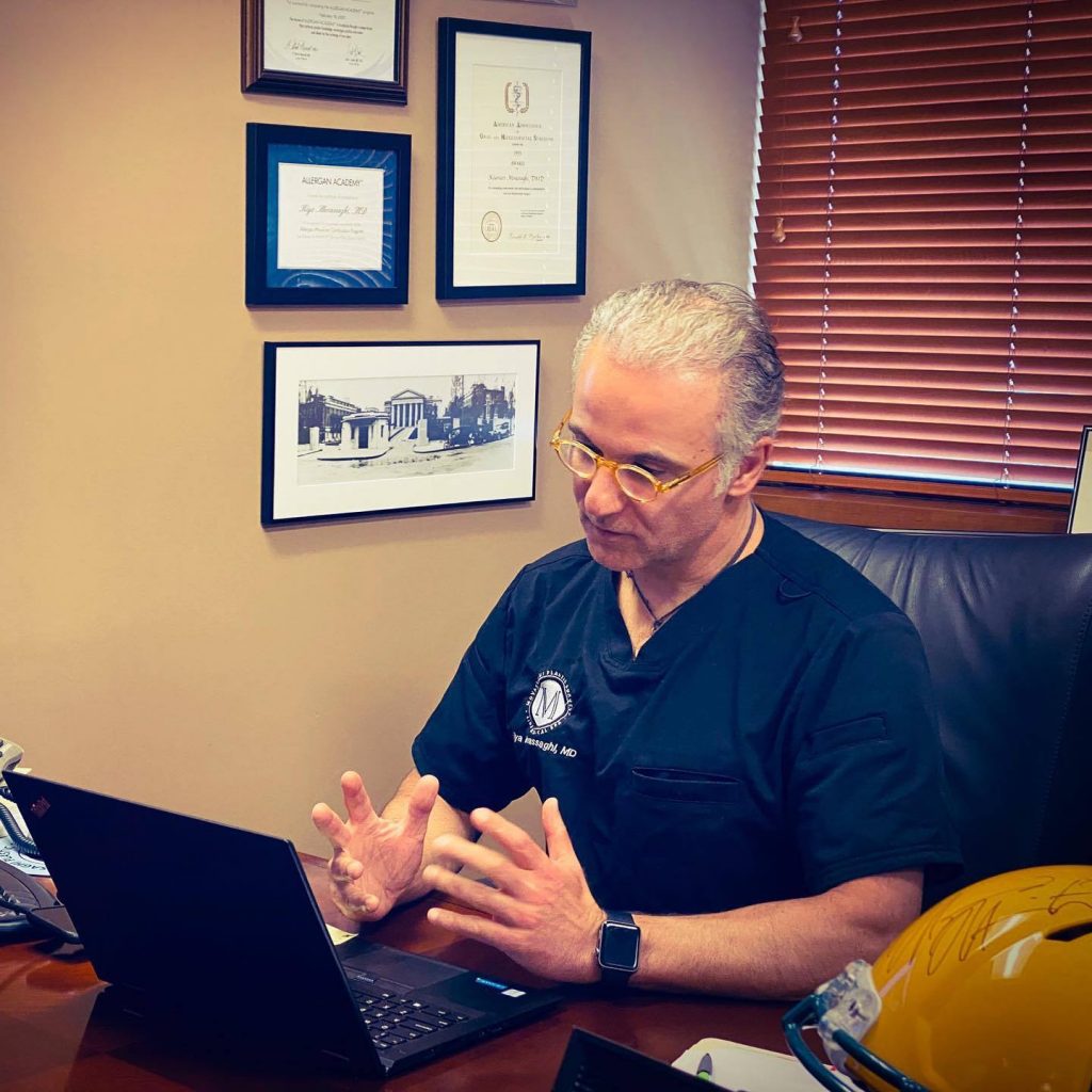 Dr. Kiya Movassaghi performing a virtual consultation at his Eugene plastic surgery practice Dr. Kiya Movassaghi performing a virtual consultation at his Eugene plastic surgery practice