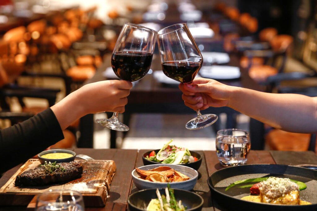 Two people drinking red wine on Valentine's Day in Eugene, Oregon