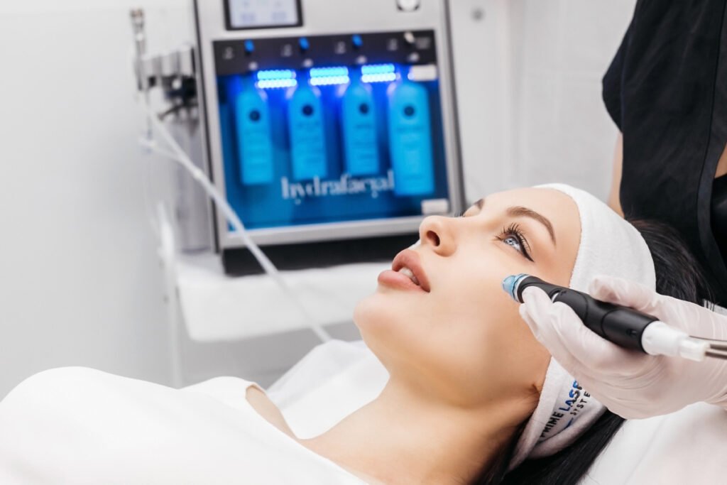 Woman getting hydrafacial treatment at a med spa